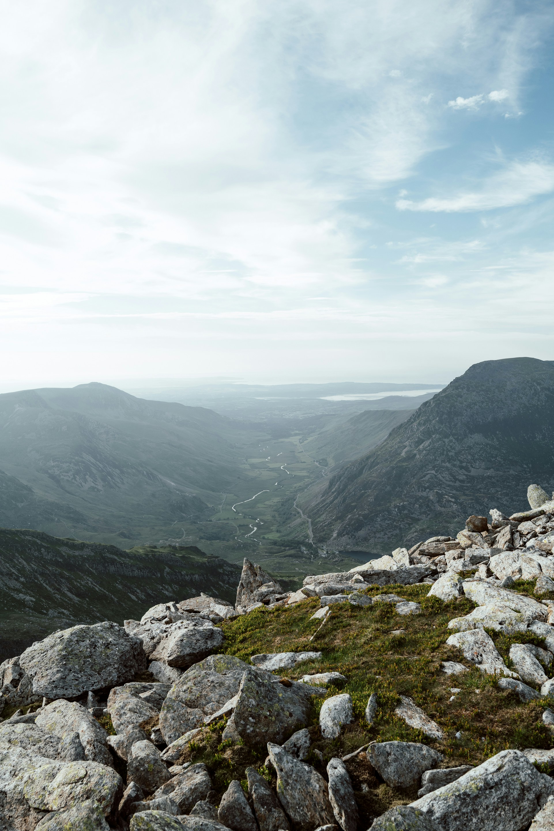A wide Welsh mountain valley opening toward the coast
